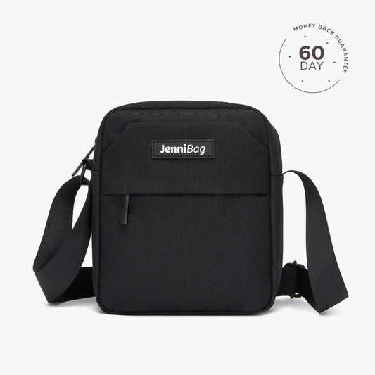 A beige Jenni crossbody bag with a zipper closure and an adjustable strap, displayed against a white background.