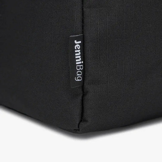 Close-up of a black bag with a label