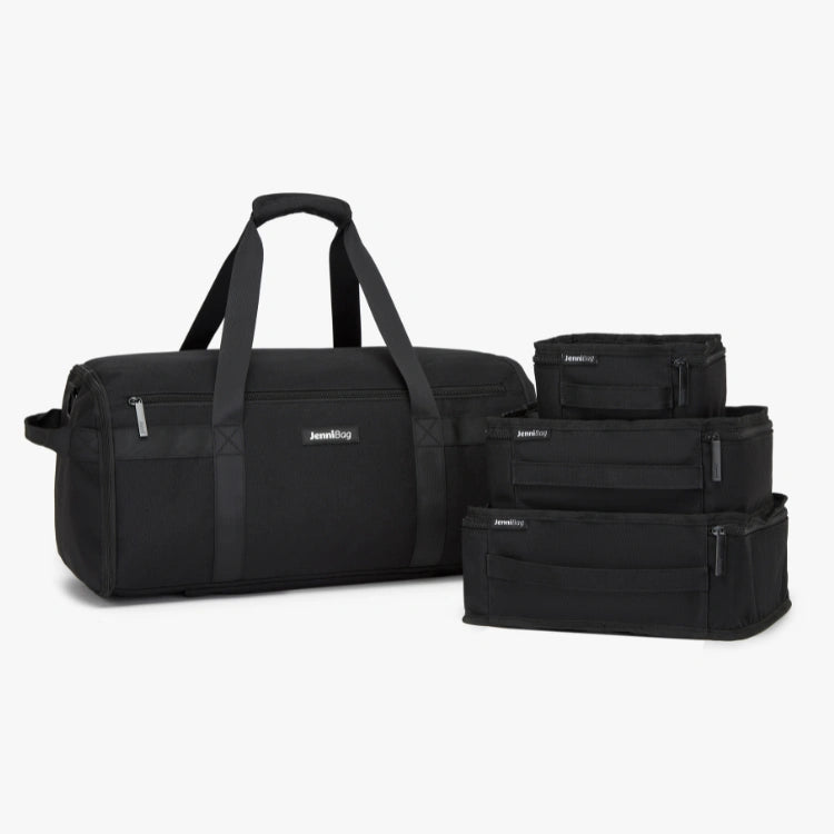 Set of black travel bags on a white background