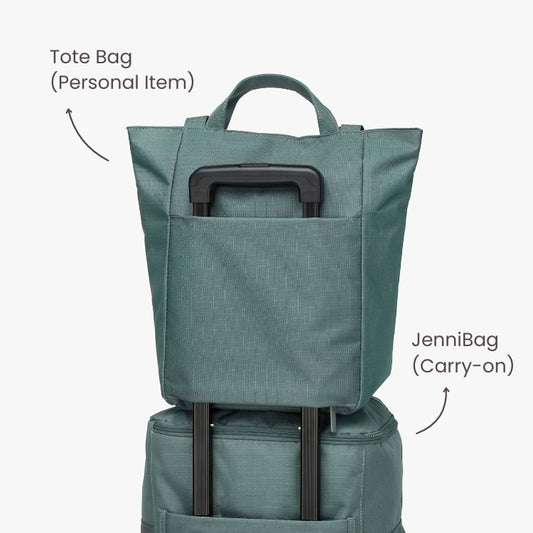 Green tote bag and backpack stacked, with labels indicating use as a personal item and carry-on.