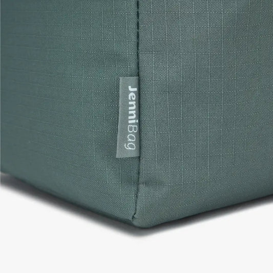 Close-up of a green bag with a label
