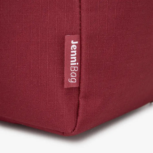 Close-up of a red bag with a label