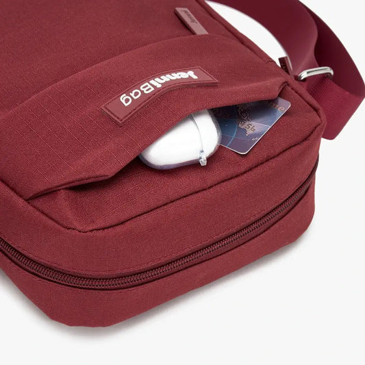 Red bag with a zipper and card pocket on a white background