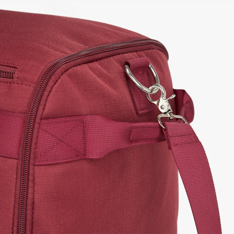 Close-up of a maroon bag's zipper and strap.