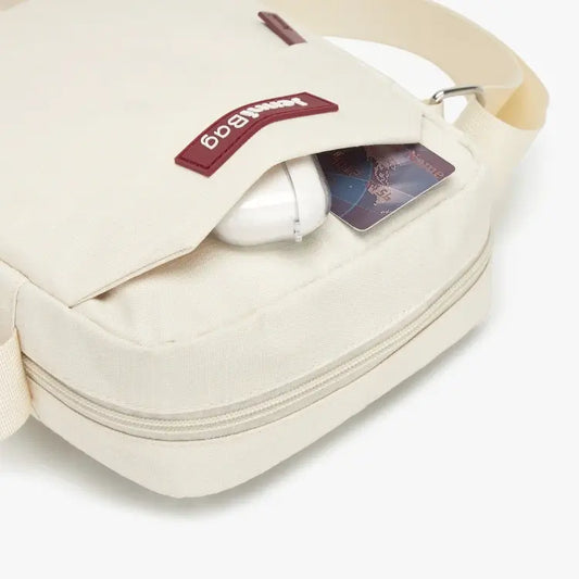 White bag with a headband and card on a white background