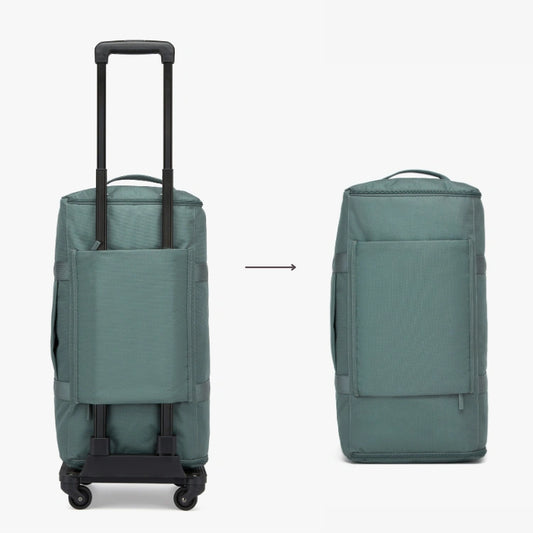 Teal rolling suitcase and backpack on a white background