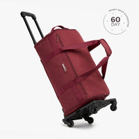 A beige travel duffel bag with multiple compartments and a shoulder strap, displayed against a white background with a '60 DAY' guarantee seal in the top right corner.