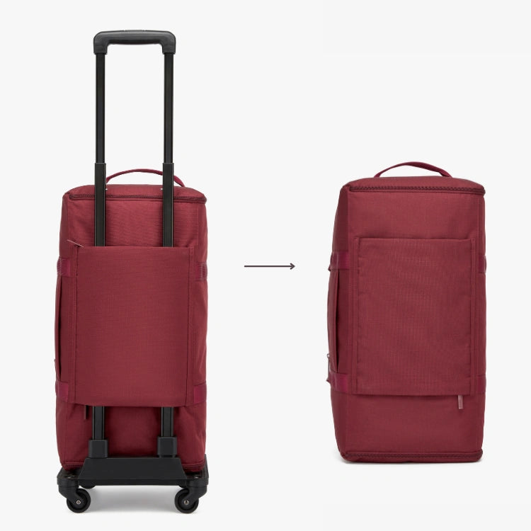 Red rolling suitcase and backpack side by side on a white background.