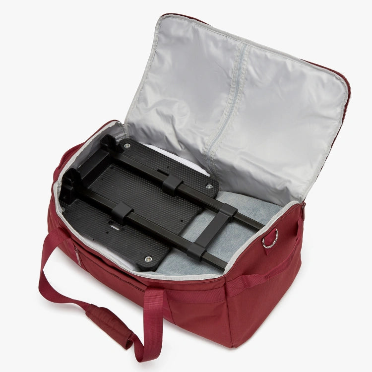 Red bag with open compartment showing black interior and red handle.