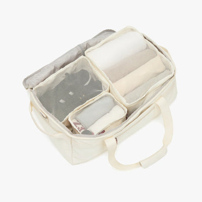 Packing cubes and folded clothes organized inside JenniBag