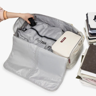 A compressed vacuum bag being packed into JenniBag