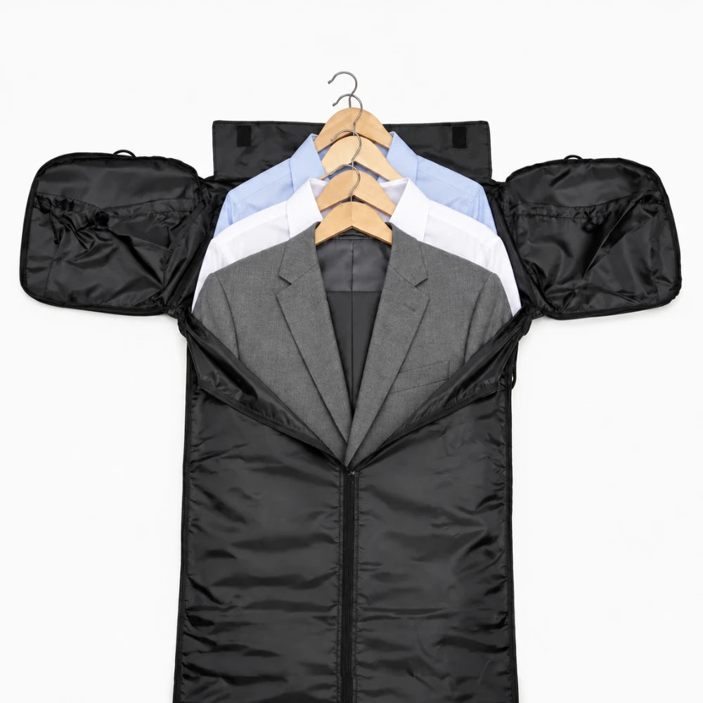 The Original Carry-on opened flat with a suit jacket and two dress shirts on hangers in the garment section.