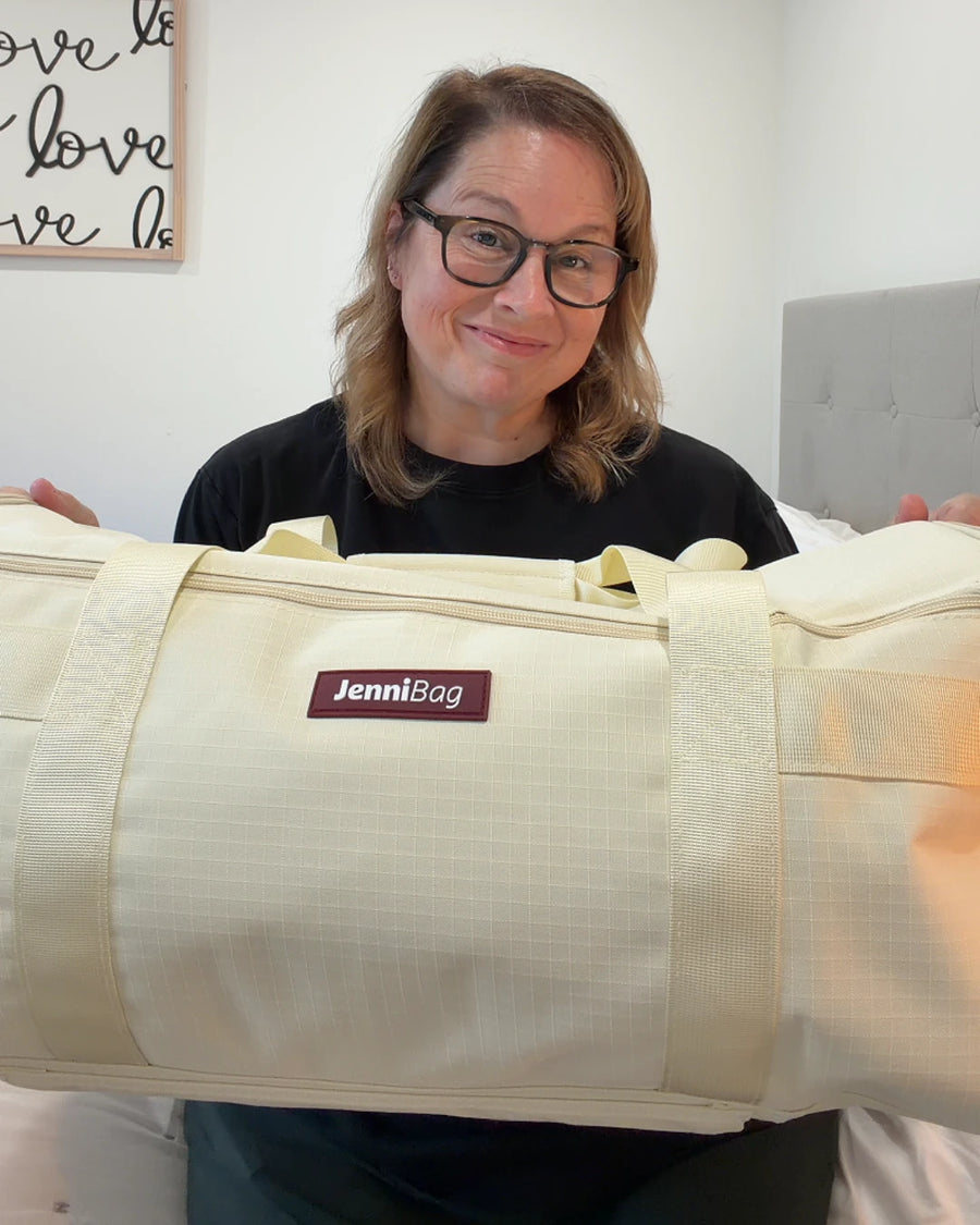 Customer holding a beige JenniBag
