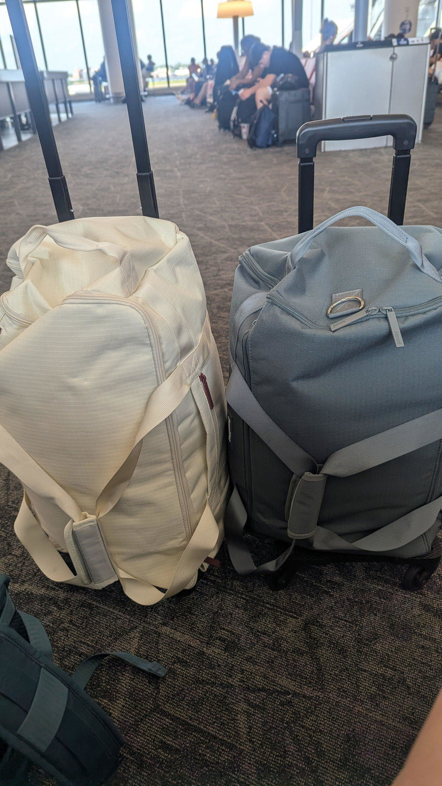 Two JenniBags with roller bases packed for a trip